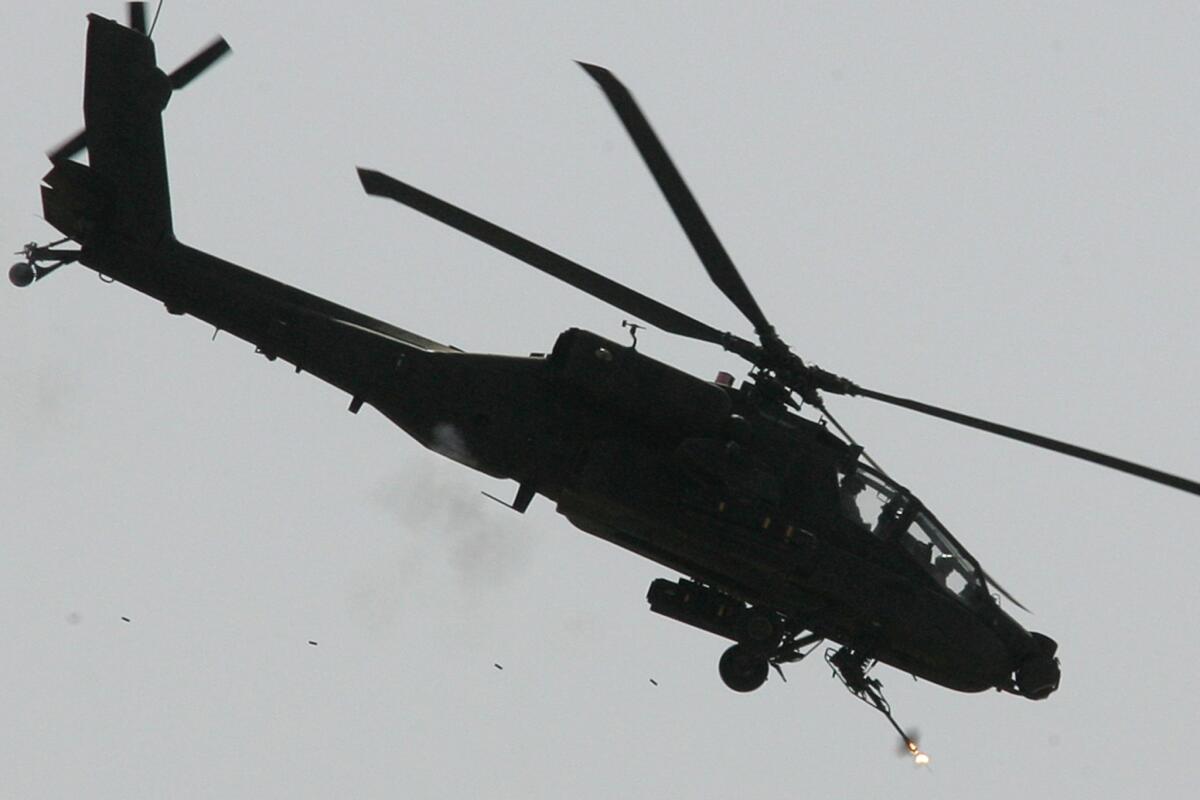 A U.S. Apache helicopter covers U.S. soldiers outside Baqubah, Iraq, in 2007. Iraq will be allowed to lease and buy Apaches from the U.S., the Pentagon said Monday.