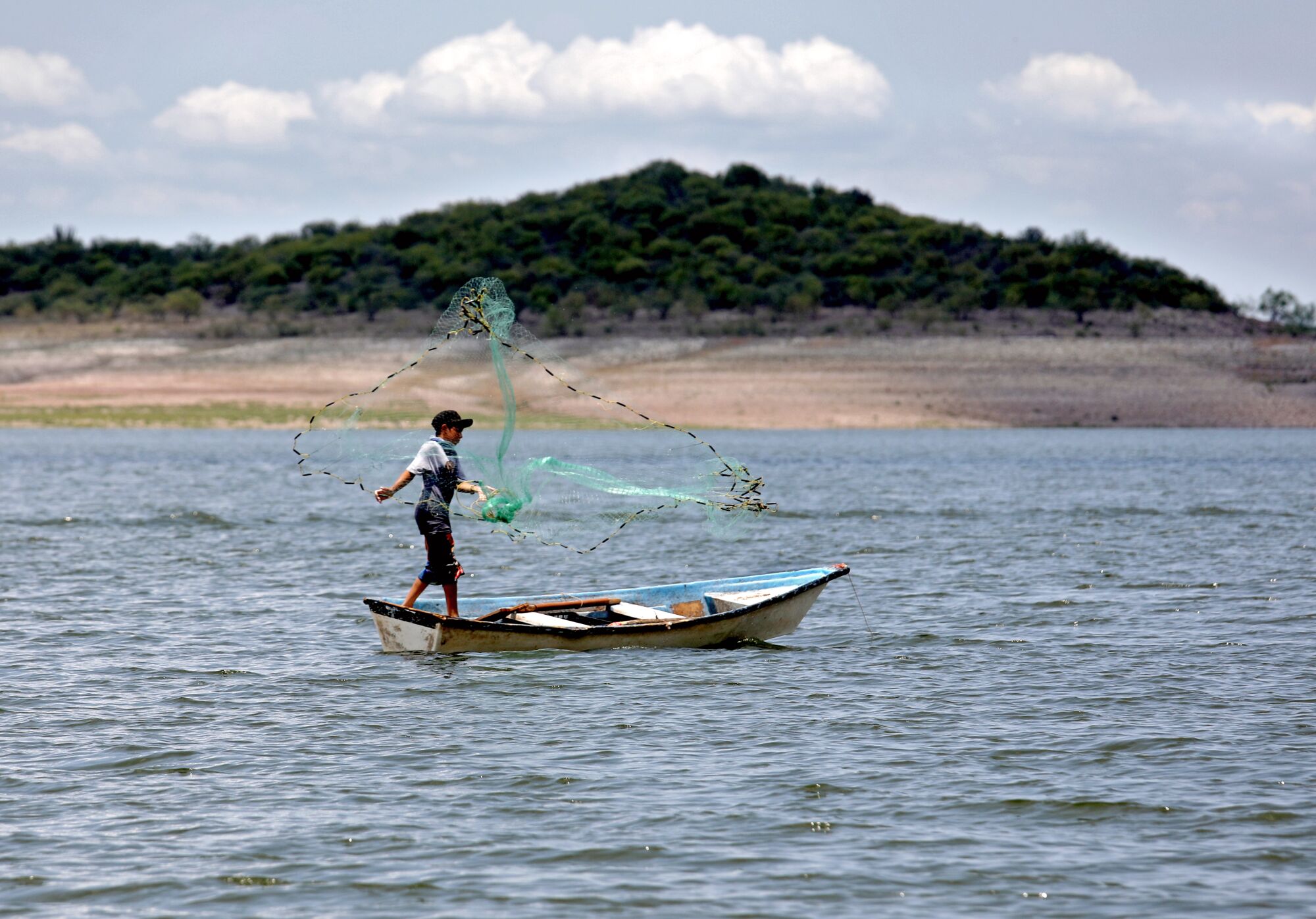 A fisherman on Agua Caliente reservoir