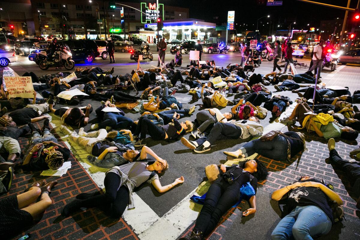 Protesters stage a "die-in" on a Los Angeles street Wednesday night to represent Michael Brown's body lying in the Ferguson, Mo., street where he was shot.