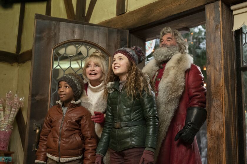 EXCLUSIVE: THE CHRISTMAS CHRONICLES: PART TWO (L to R) JAHZIR BRUNO as JACK, GOLDIE HAWN as MRS. CLAUS, DARBY CAMP as KATE, KURT RUSSELL as SANTA CLAUS in THE CHRISTMAS CHRONICLES: PART TWO. Cr. JOSEPH LEDERER/NETFLIX © 2020