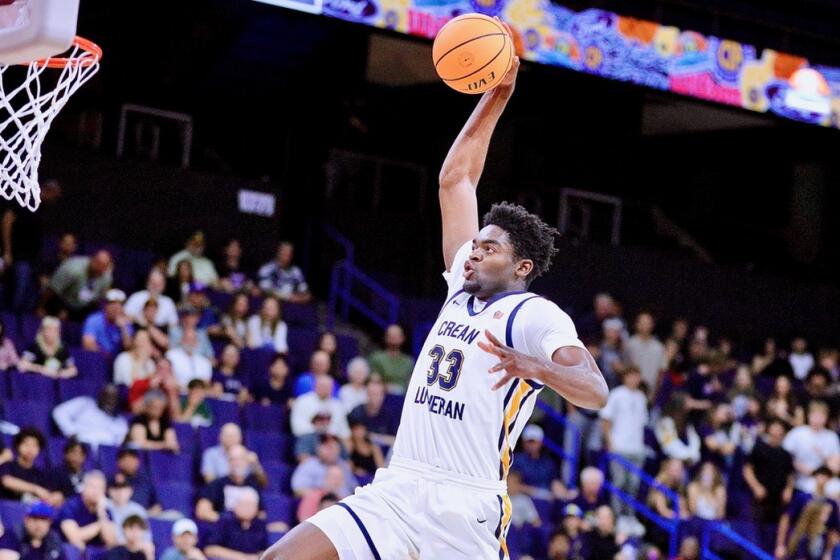 Chadrack Mpoyi of Crean Lutheran delivers dunk against JSerra.