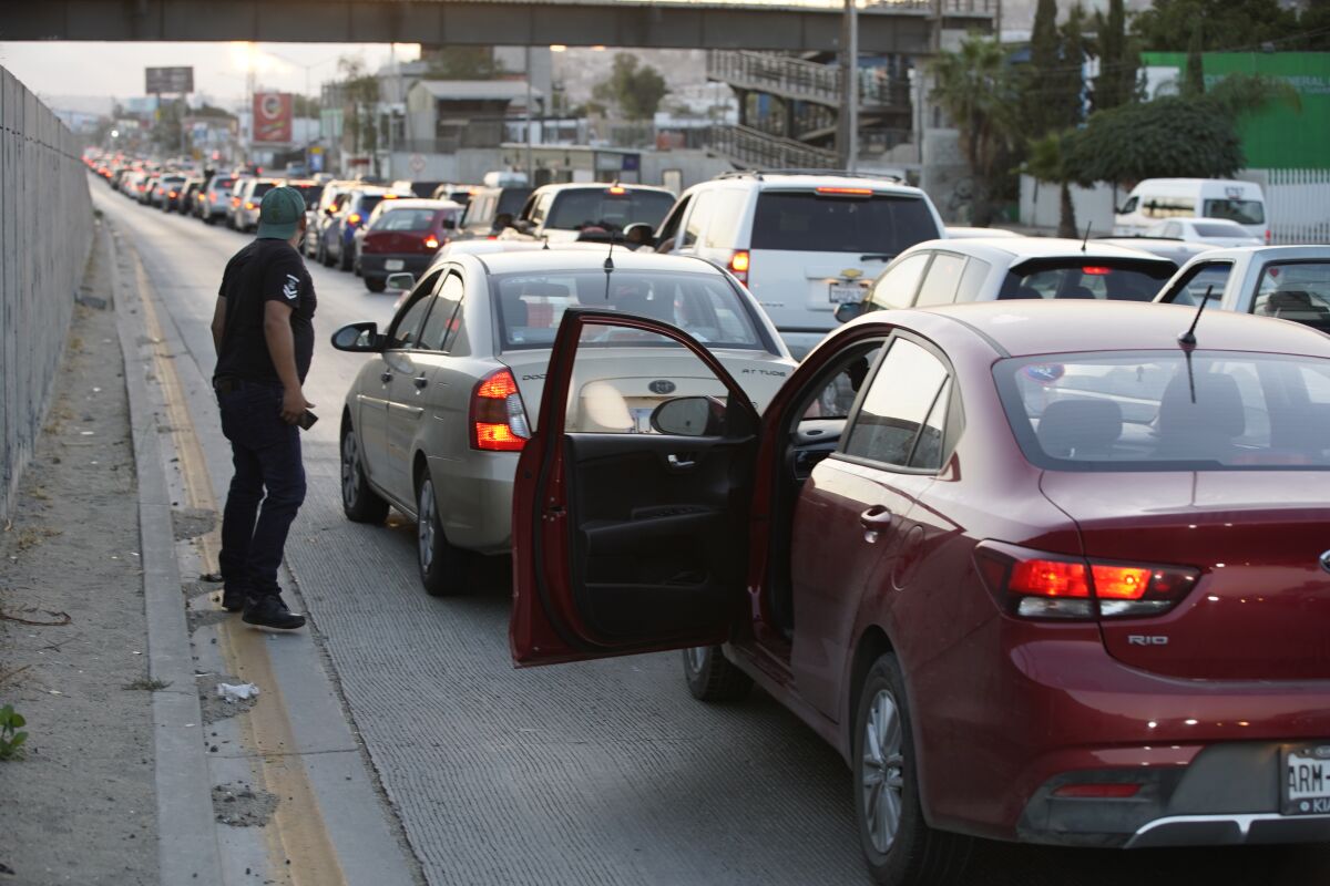 TIJUANA, BAJA CALIFORNIA - AUGUST 23: Traffic into San Ysidro from Tijuana is backed up well past Colonia Buena Vista