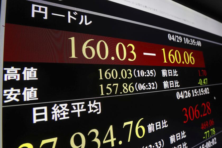 A monitor shows U.S. dollar/Japanese yen exchange rate in Tokyo Monday, April 29, 2024. (Kyodo News via AP)