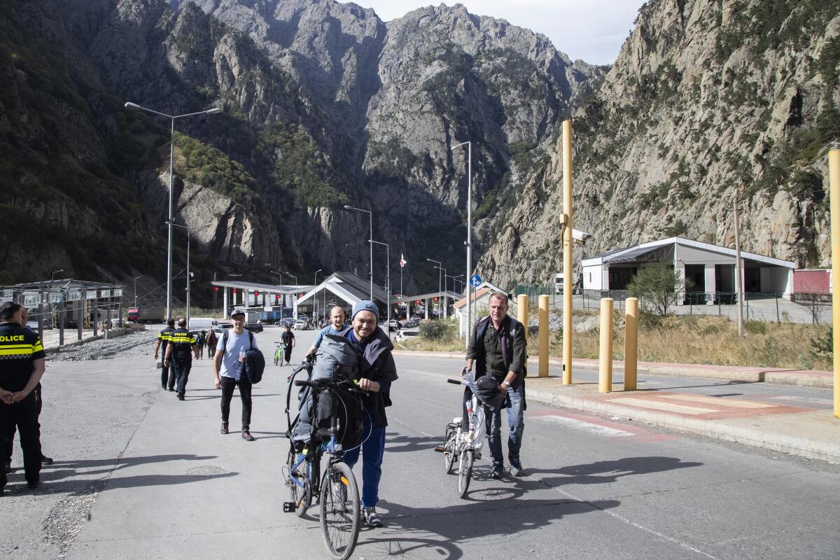 Men on bicycles. 