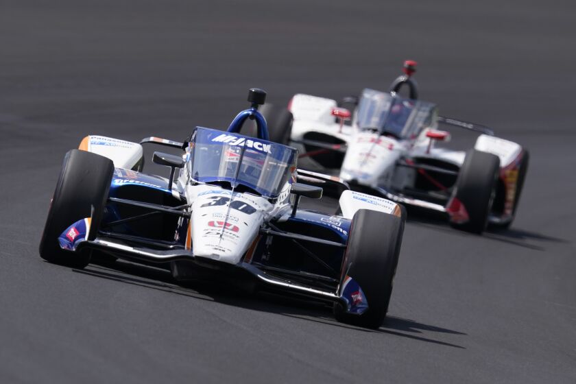 Takuma Sato, of Japan, leads Marco Andretti into turn one during the Indianapolis 500.