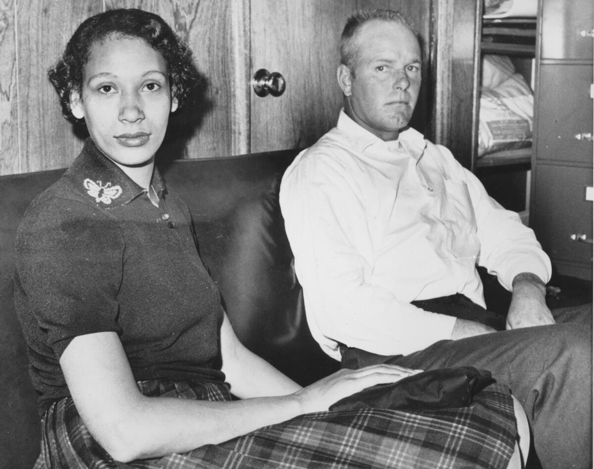 Mildred and Richard Loving pictured seated and facing the camera in 1965.