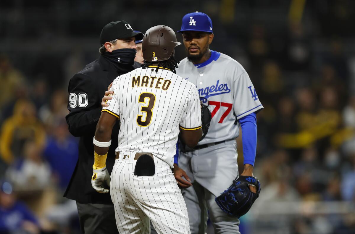 San Diego's Jorge Mateo exchanges words with Dodgers reliever Dennis Santana in the 10th inning Friday.