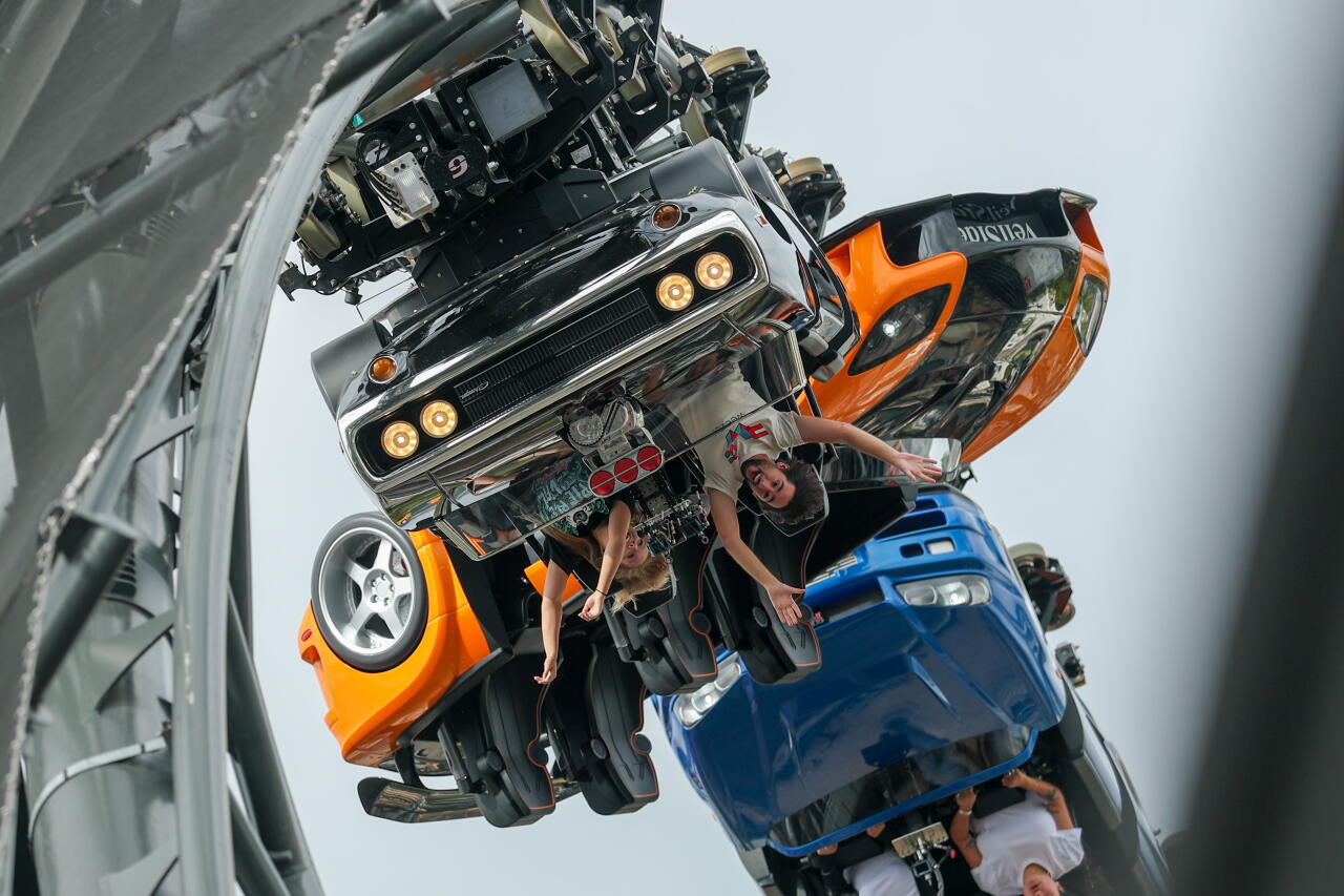 Attendees go upside down while riding the Fast & Furious: Hollywood Drift coaster at Universal Studios Hollywood