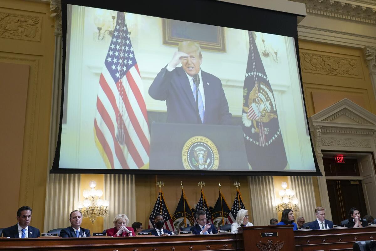 FILE - A video of President Donald Trump recording a statement on Jan. 7, 2021, is played, as the House select committee investigating the Jan. 6 attack on the U.S. Capitol holds a hearing at the Capitol in Washington, July 21, 2022. The House Jan. 6 committee is eyeing a close to its work and a final report laying out its findings about the U.S. Capitol insurrection by the end of the year. But the investigation is not over. (AP Photo/J. Scott Applewhite, File)