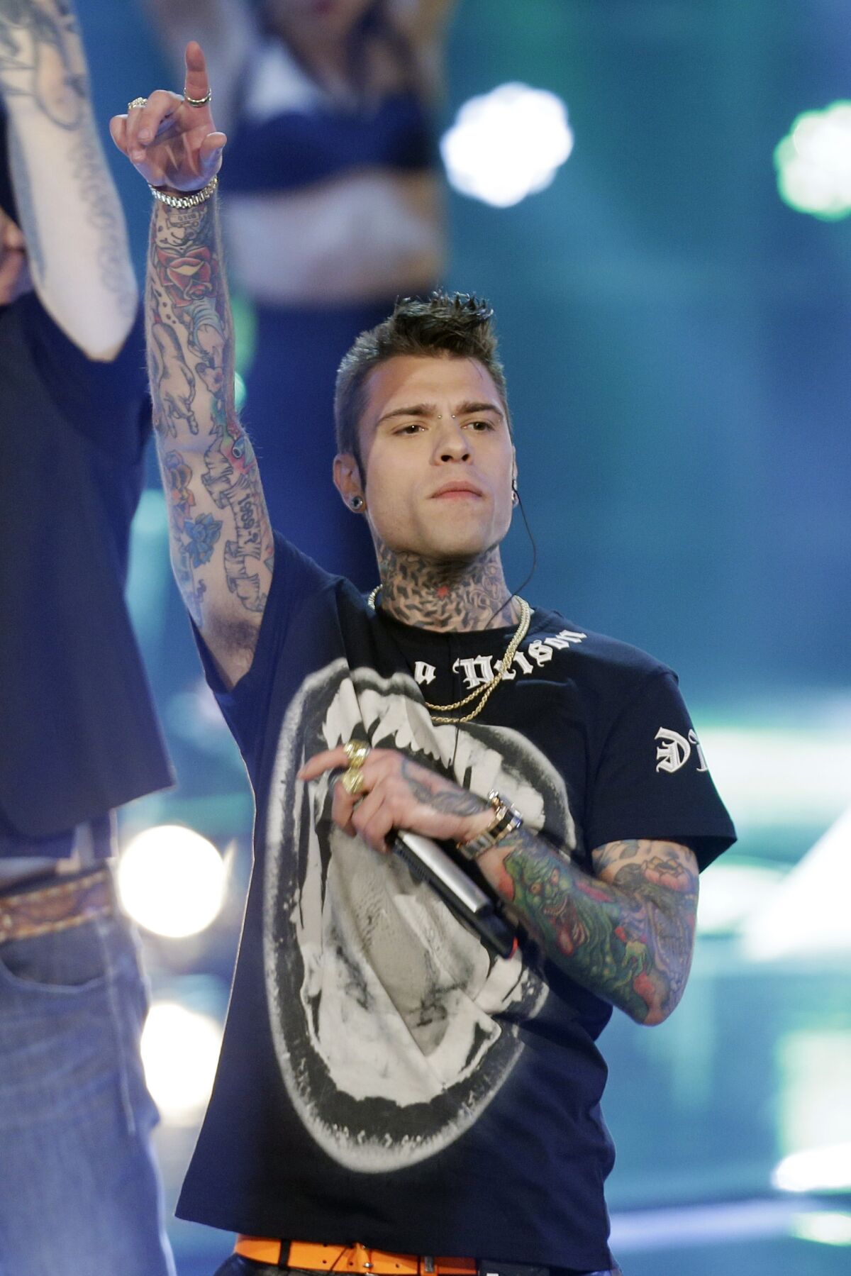 In this photo taken on May 28, 2014, Italian rapper Fedez perform during the Italian State RAI TV program "The Voice of Italy", in Milan, Italy. Italian rapper Fedez received a wave of public support Sunday after going public with attempts by RAI state television to censor planned remarks on homophobia during an annual Worker's Day concert. (AP Photo/Luca Bruno)