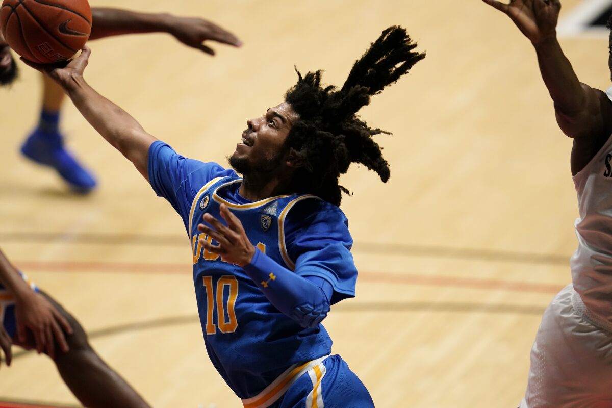 UCLA guard Tyger Campbell shoots during the first half against San Diego State.
