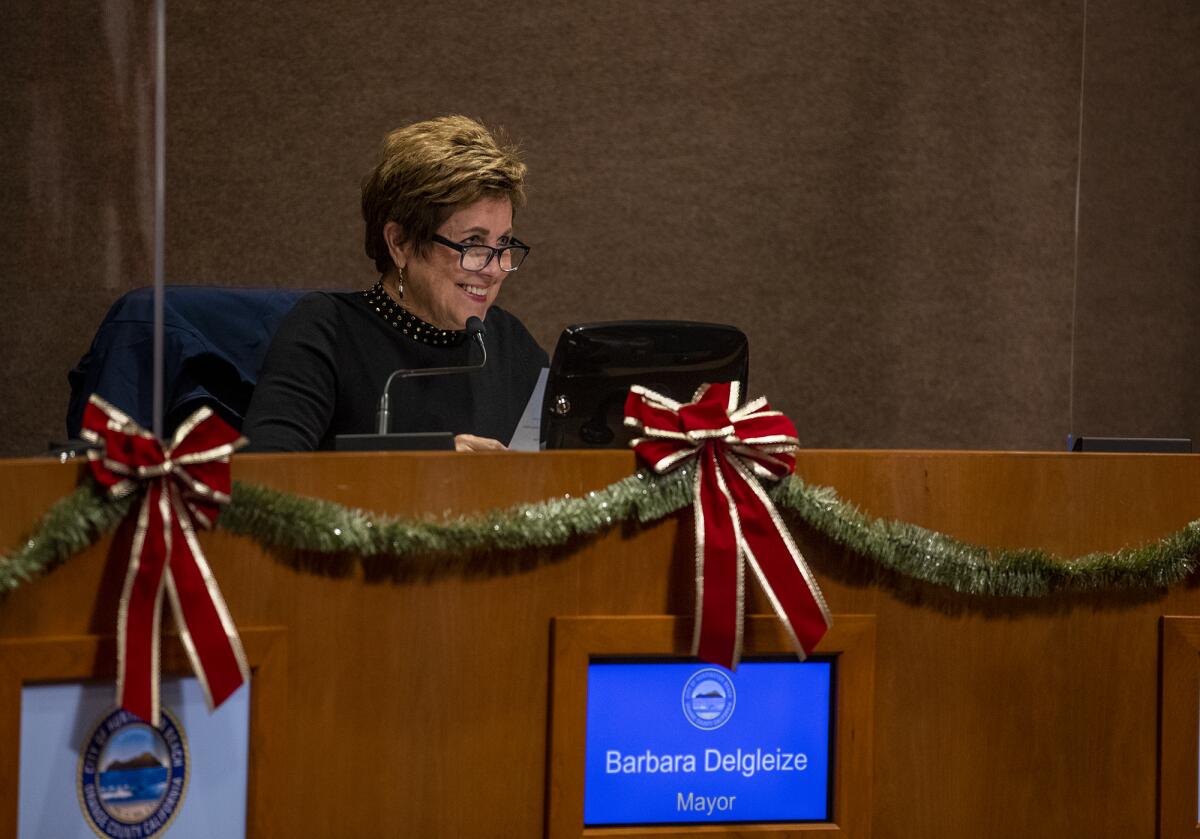 Barbara Delgleize smiles at the crowd after taking over as city of Huntington Beach's mayor during a City Council meeting.