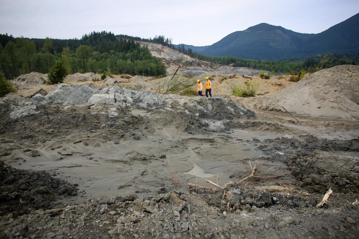 Washington Gov. Jay Inslee and his wife, Trudi, visit the site of the Oso landslide May 15.