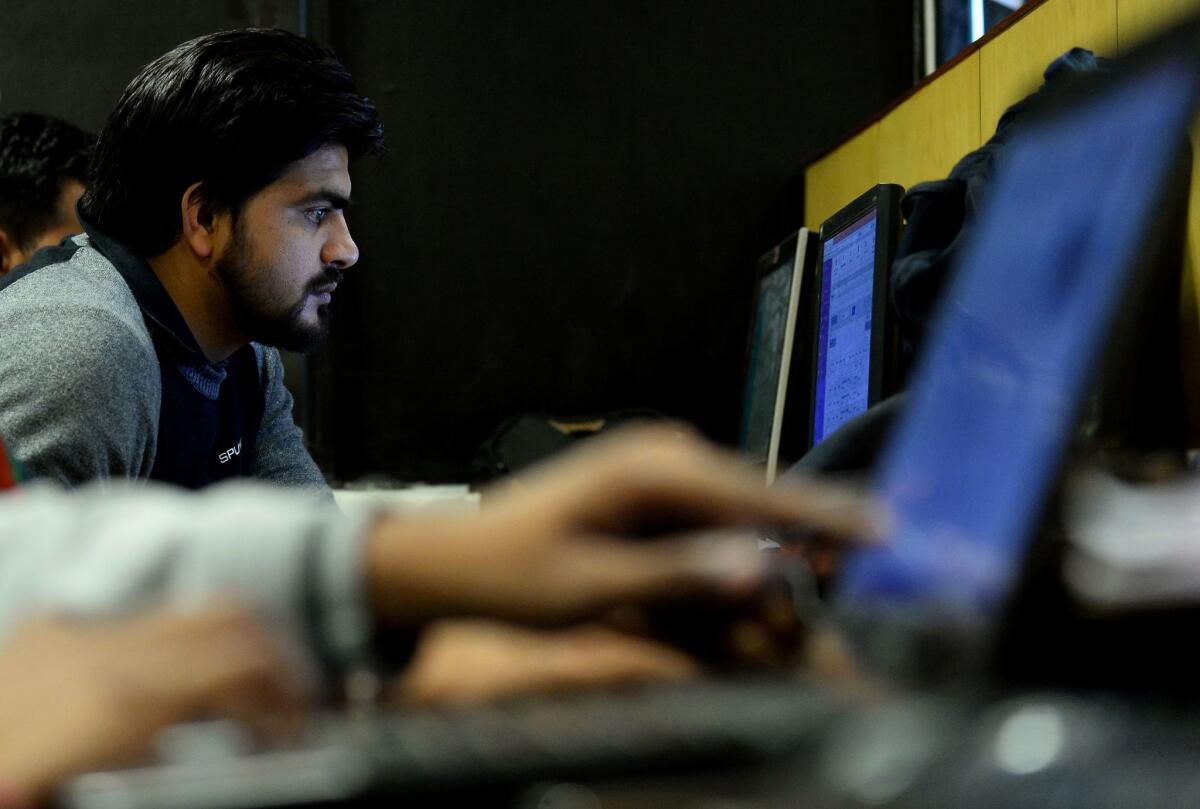 An employee of Indian IT security solutions company Innefu Labs works at its offices in New Delhi.