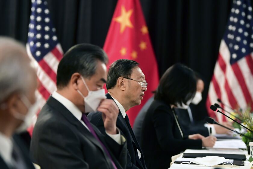 Chinese Communist Party foreign affairs chief Yang Jiechi, center, and China's State Councilor Wang Yi, second from left, speak at the opening session of US-China talks at the Captain Cook Hotel in Anchorage, Alaska, Thursday, March 18, 2021. (Frederic J. Brown/Pool via AP)