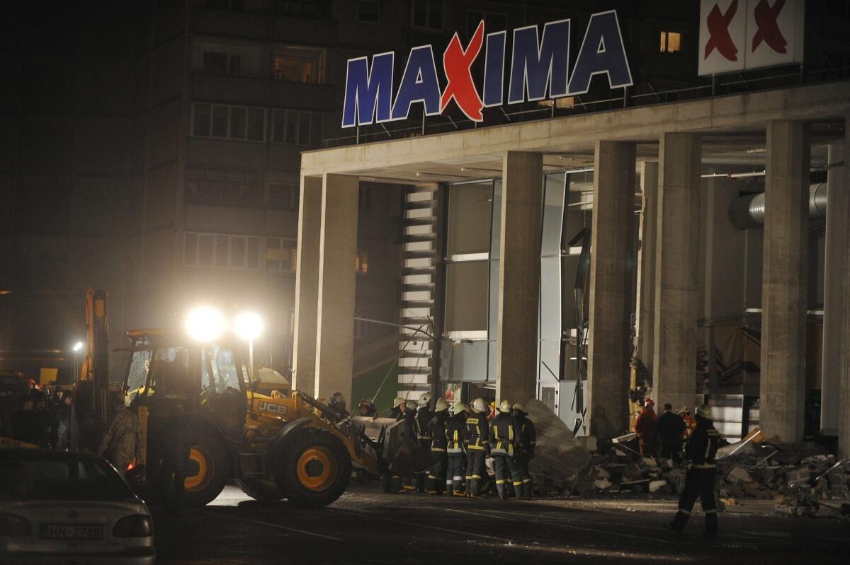 Rescuers search for survivors at the Maxima XX supermarket in Riga, Latvia, after a roof collapsed.