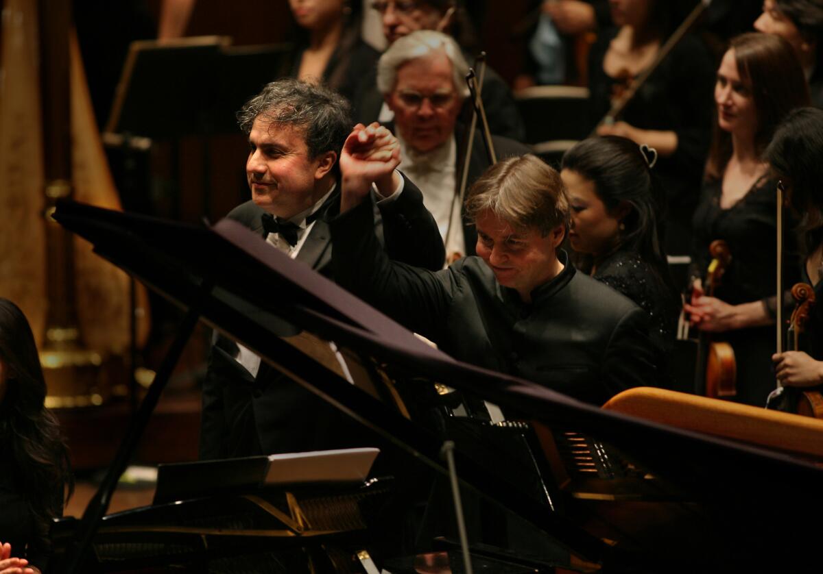 Yefim Bronfman taking a bow along with Esa -Pekka Salonen with the New York Philharmonic at Lincoln Center in 2007.