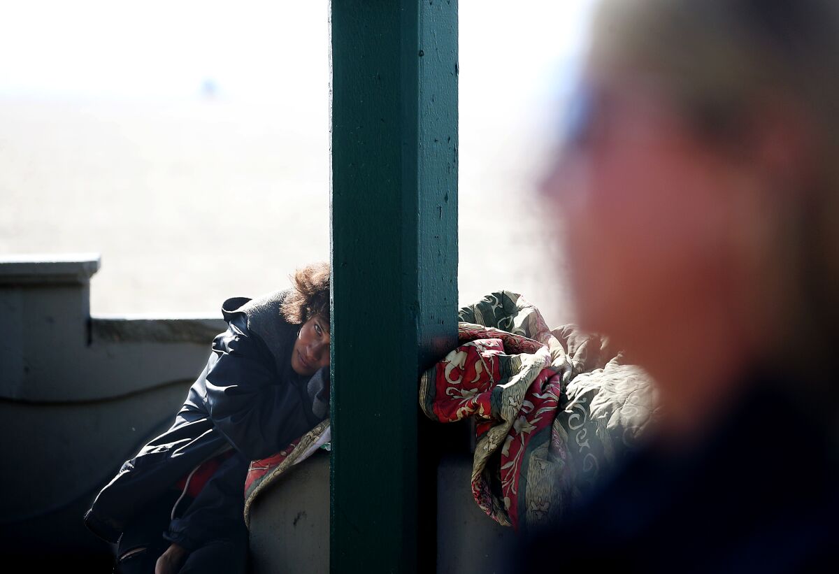 A homeless woman along the boardwalk in Venice Beach.