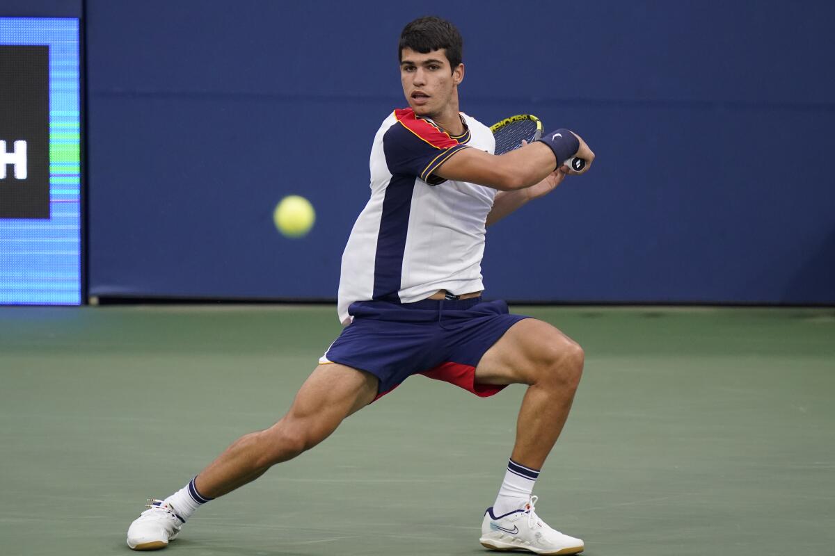 Carlos Alcaraz, of Spain, returns against Peter Gojowczyk, of Germany, during the fourth round of the U.S. Open tennis championships, Sunday, Sept. 5, 2021, in New York. (AP Photo/Frank Franklin II)