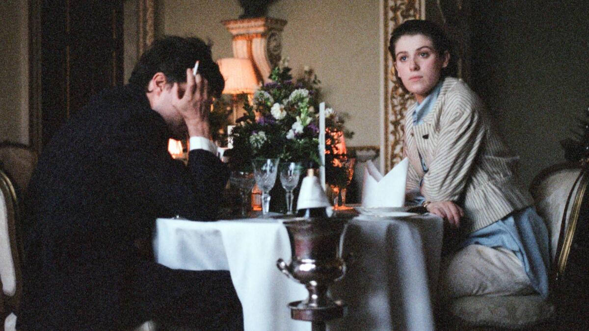 Tom Burke and Honor Swinton Byrne in the movie "The Souvenir."