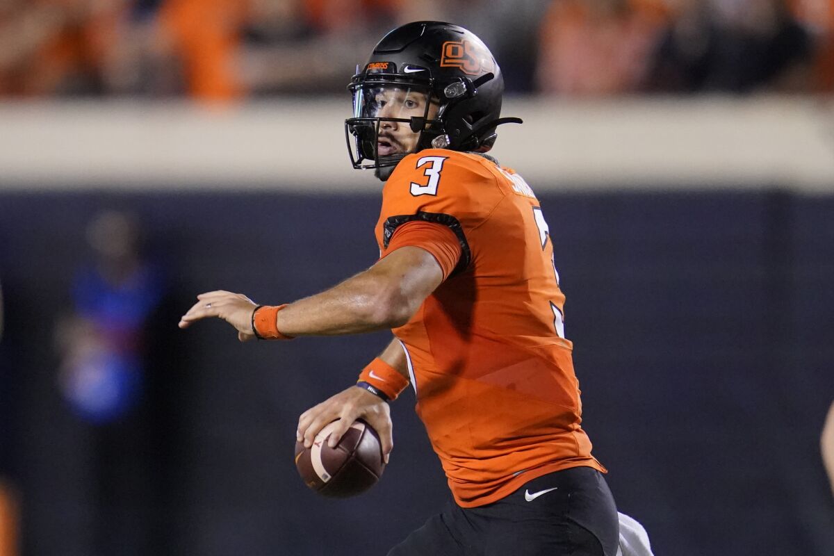 Oklahoma State quarterback Spencer Sanders (3) throws in the second half of an NCAA college football game against Baylor, Saturday, Oct. 2, 2021, in Stillwater, Okla. (AP Photo/Sue Ogrocki)