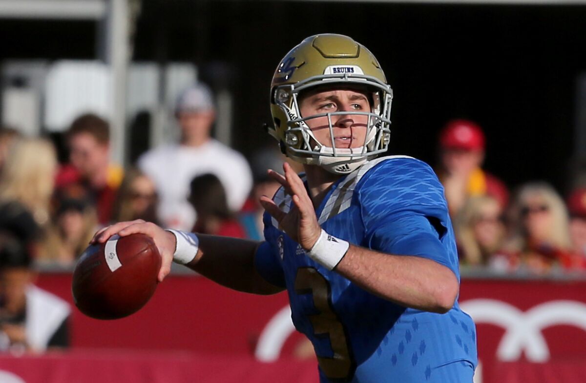UCLA quarterback Josh Rosen looks downfield for an open receiver against USC in the second half on Nov. 28, 2015.
