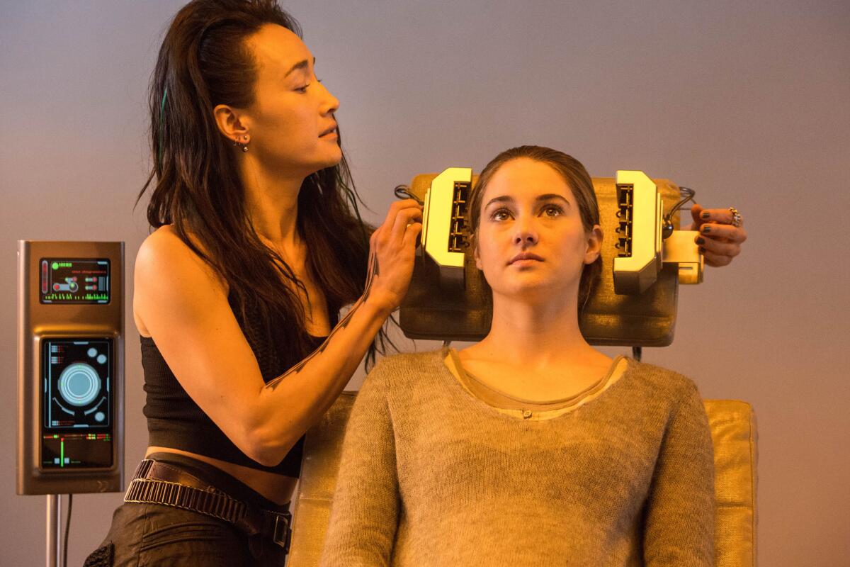 Lionsgate's "Divergent" -- with Maggie Q, left, and Shailene Woodley -- was released Friday.