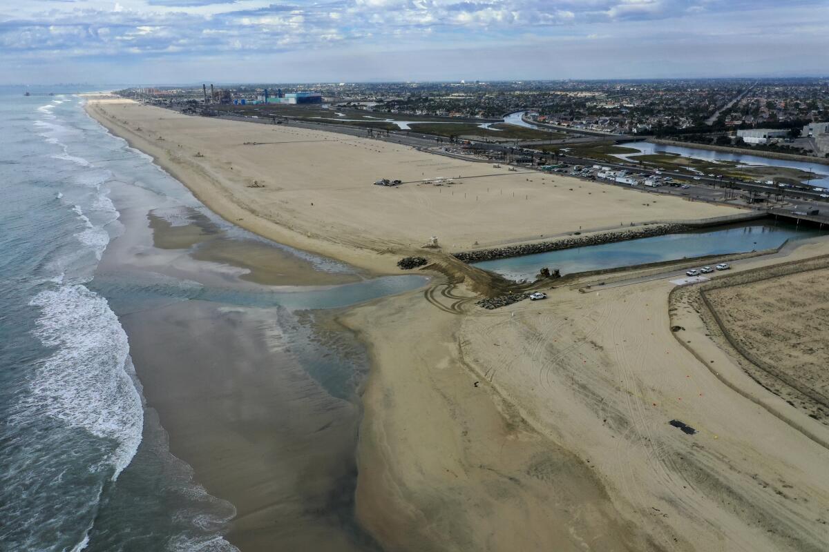 An aerial view of the oil spill in Orange County, as low tide reveals oil on the beach.