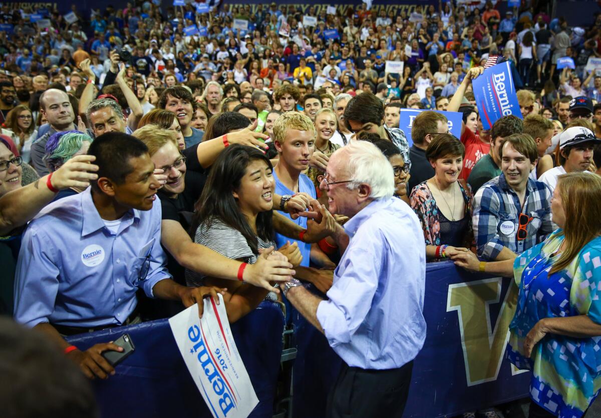 Presidential candidate Sen. Bernie Sanders of Vermont talks to supporters during a rally at the University of Washington, in Seattle, on Saturday.