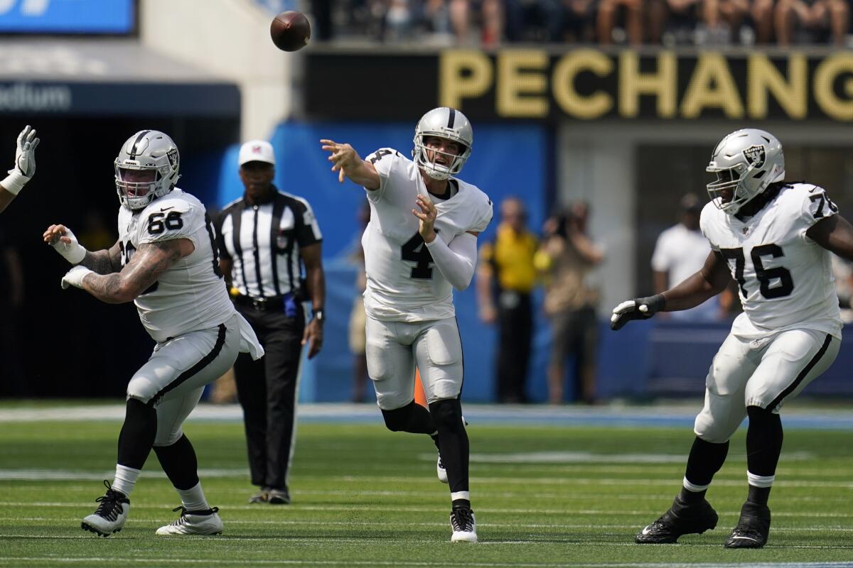 Las Vegas Raiders quarterback Derek Carr passes against the Chargers in the second half.