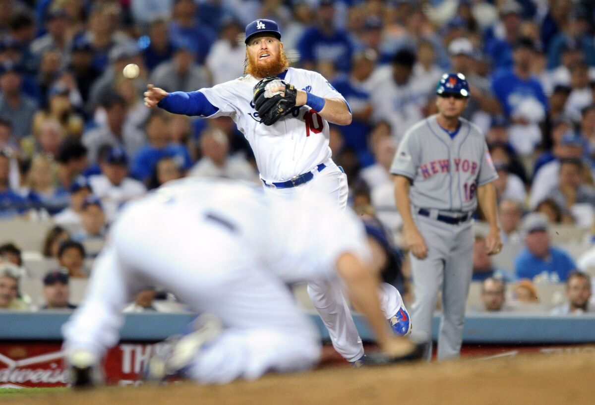 Dodgers third baseman Justin Turner throws out Mets batter Travis d'Arnaud in the 6th inning during Game 1 of the National League Division Series on Oct. 9.