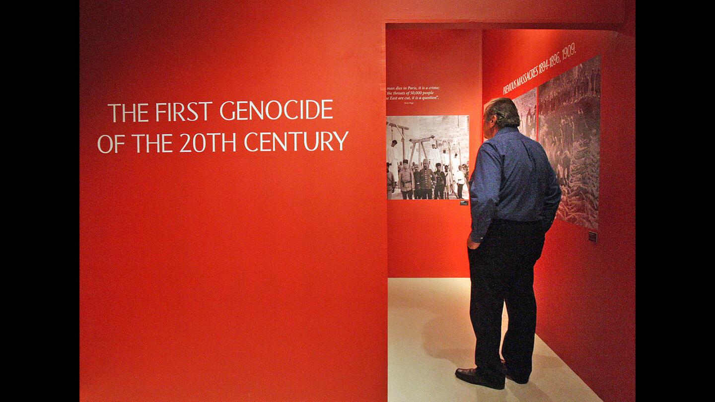 Zaven Kazazian enters the next part of the gallery showing the history of the genocide in a gallery named "Armenia: An Open Wound," at the Brand Library & Art Center in Glendale on Monday, April 18, 2016. The City of Glendale and the Library, Arts & Culture Department presented the gallery in partnership with the Armenian American Museum.