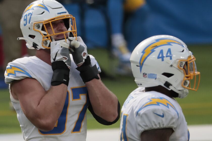 Chargers defensive end Joey Bosa (97) grimaces after jumping offsides against the Panthers.