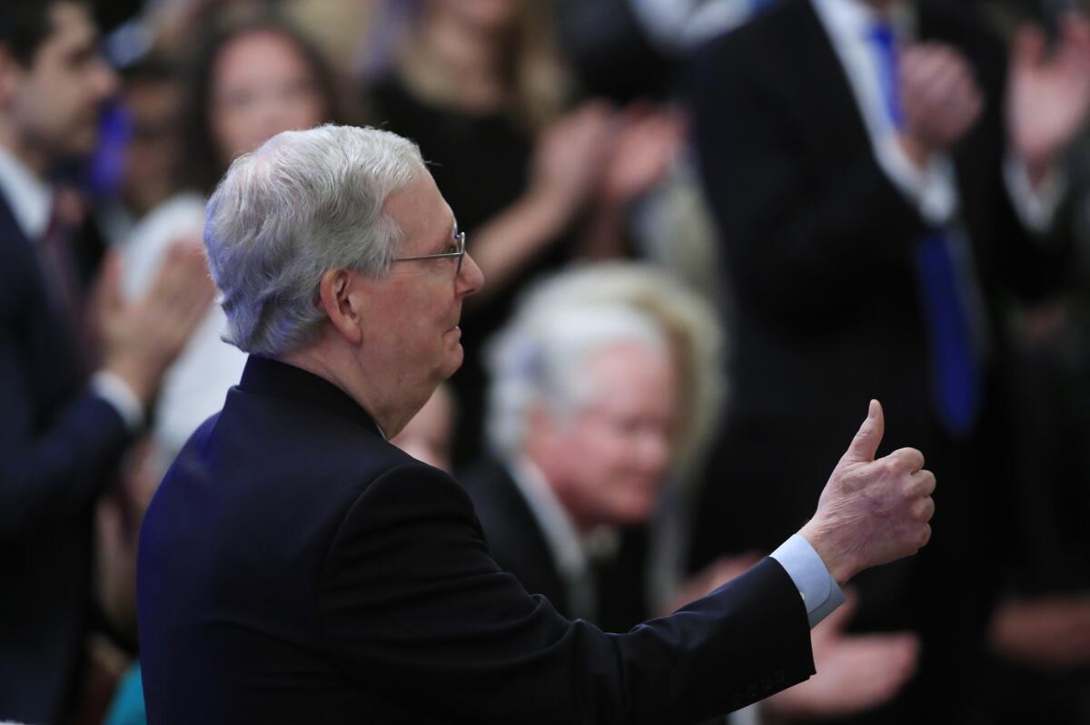 Senate Majority Leader Mitch McConnell (R-Ky.) smiles during a ceremony for Supreme Court Justice Brett Kavanaugh at the White House Monday.