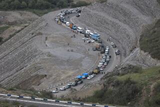 FILE - Ethnic Armenians flee Nagorno-Karabakh to Kornidzor, in Armenia's Syunik region, Tuesday, Sept. 26, 2023. Armenia and Azerbaijan on Wednesday, Dec. 13, 2023, exchanged prisoners of war, in line with an agreement announced last week that also promised the two countries would work towards a peace treaty and was hailed by the European Union as a major step toward peace in the tumultuous region. (AP Photo/Vasily Krestyaninov, File)