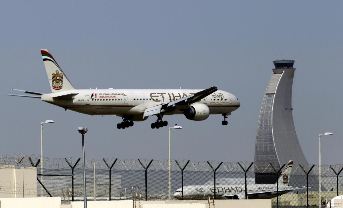 An Etihad Airways plane prepares to land at the Abu Dhabi airport in the United Arab Emirates. A group of U.S.-based airlines claim that Etihad Airways, Emirates Airline and Qatar Airways are competing unfairly in the U.S. by taking subsidies from their oil-rich governments.