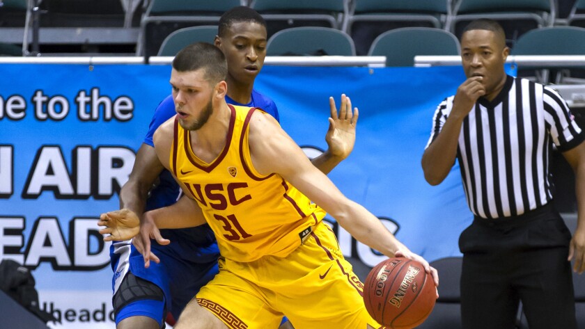 USC forward Nick Rakocevic works in the post against Middle Tennessee forward Karl Gamble during a semifinal game of the Diamond Head Classic on Saturday.
