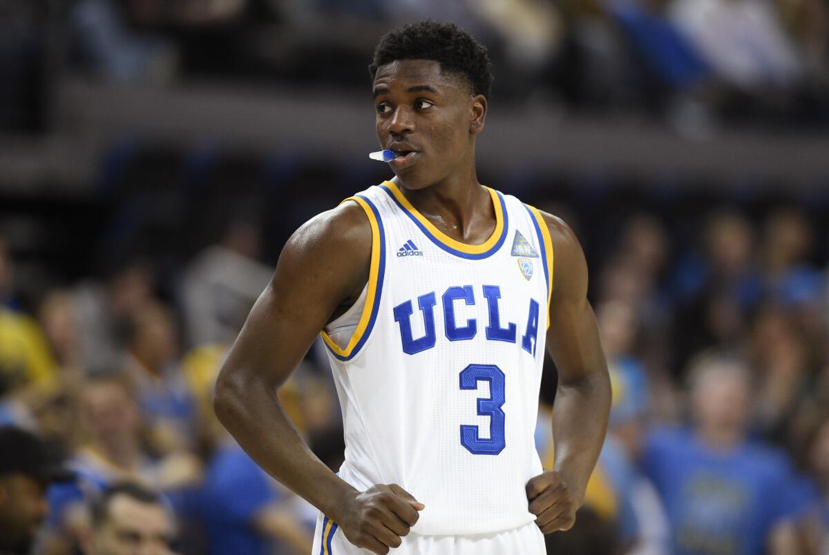 UCLA guard Aaron Holiday looks on during a break in the second half of a game against Utah on Feb. 18.