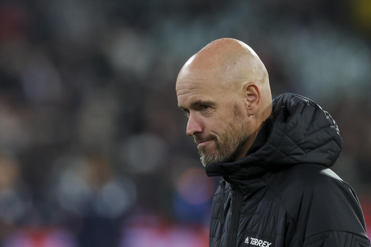 FILE - Manchester United's manager Erik ten Hag reacts as he walks onto the pitch ahead of the soccer match between Manchester United and Melbourne Victory at the Melbourne Cricket Ground, Australia, on July 15, 2022. (AP Photo/Asanka Brendon Ratnayake, File)
