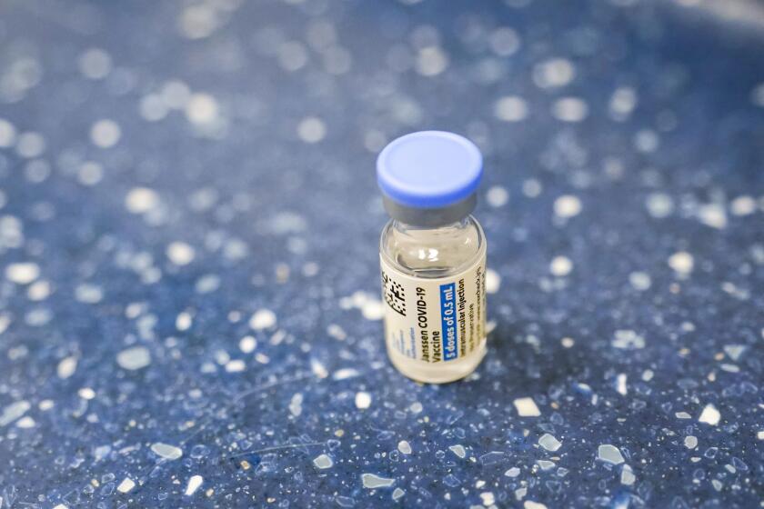 A vial with the Johnson & Johnson's one-dose COVID-19 vaccine is seen at the Vaxmobile, at the Uniondale Hempstead Senior Center, Wednesday, March 31, 2021, in Uniondale, N.Y. The Vaxmobile, is a COVID-19 mobile vaccination unit, sponsored by a partnership between Mount Sinai South Nassau and Town of Hempstead to bring the one-dose vaccine directly to hard-hit communities in the area. (AP Photo/Mary Altaffer)