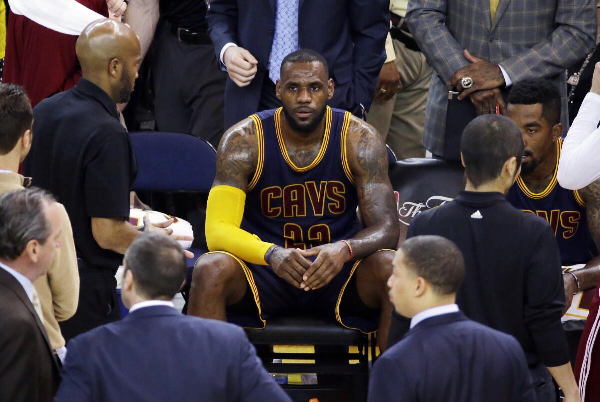 Cavaliers forward LeBron James, who finished with 40 points, 14 rebounds and 11 assists, rests during a break in the action in the second half of Game 5.