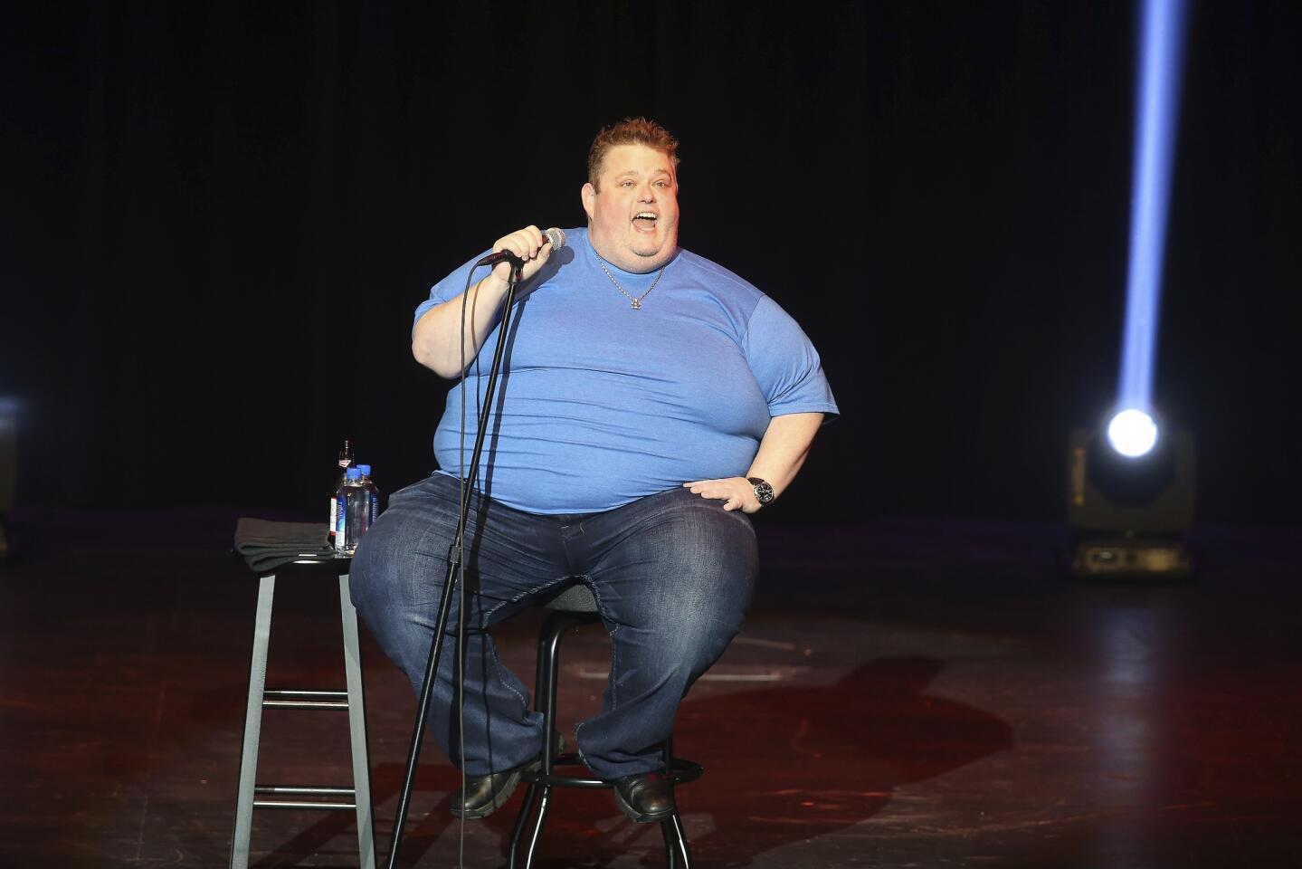 Ralphie May performs at the Paradise Cove at the River Spirit Hotel and Casino on Aug. 18, 2017. In a statement Friday, Oct. 6, 2017, publicist Stacey Pokluda says May died of cardiac arrest. She said he had been fighting pneumonia, which caused him to cancel a few appearances in the past month. Read more.