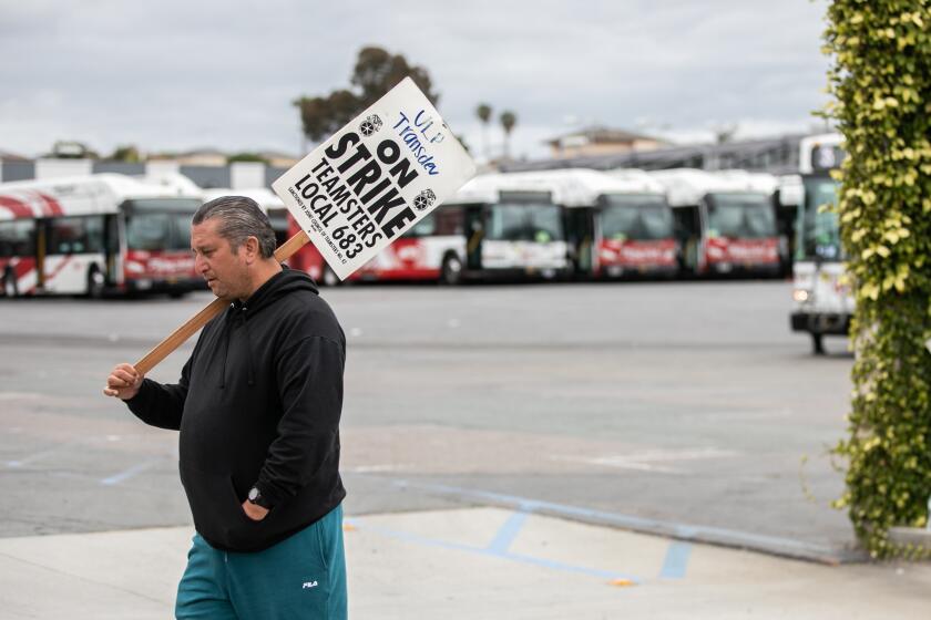 Chula Vista, CA - May 31: An MTS bus driver contracted through Transdev, a private company, strikes in front of MTS South Bay in Chula Vista, CA on Wednesday, May 31, 2023. The workers are demanding better working conditions, including access to restrooms, meal period areas and better pay. (Adriana Heldiz / The San Diego Union-Tribune)