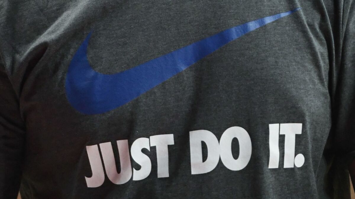 Nike's "Just Do It" slogan, seen emblazoned on a shirt, has helped propel the brand for three decades.