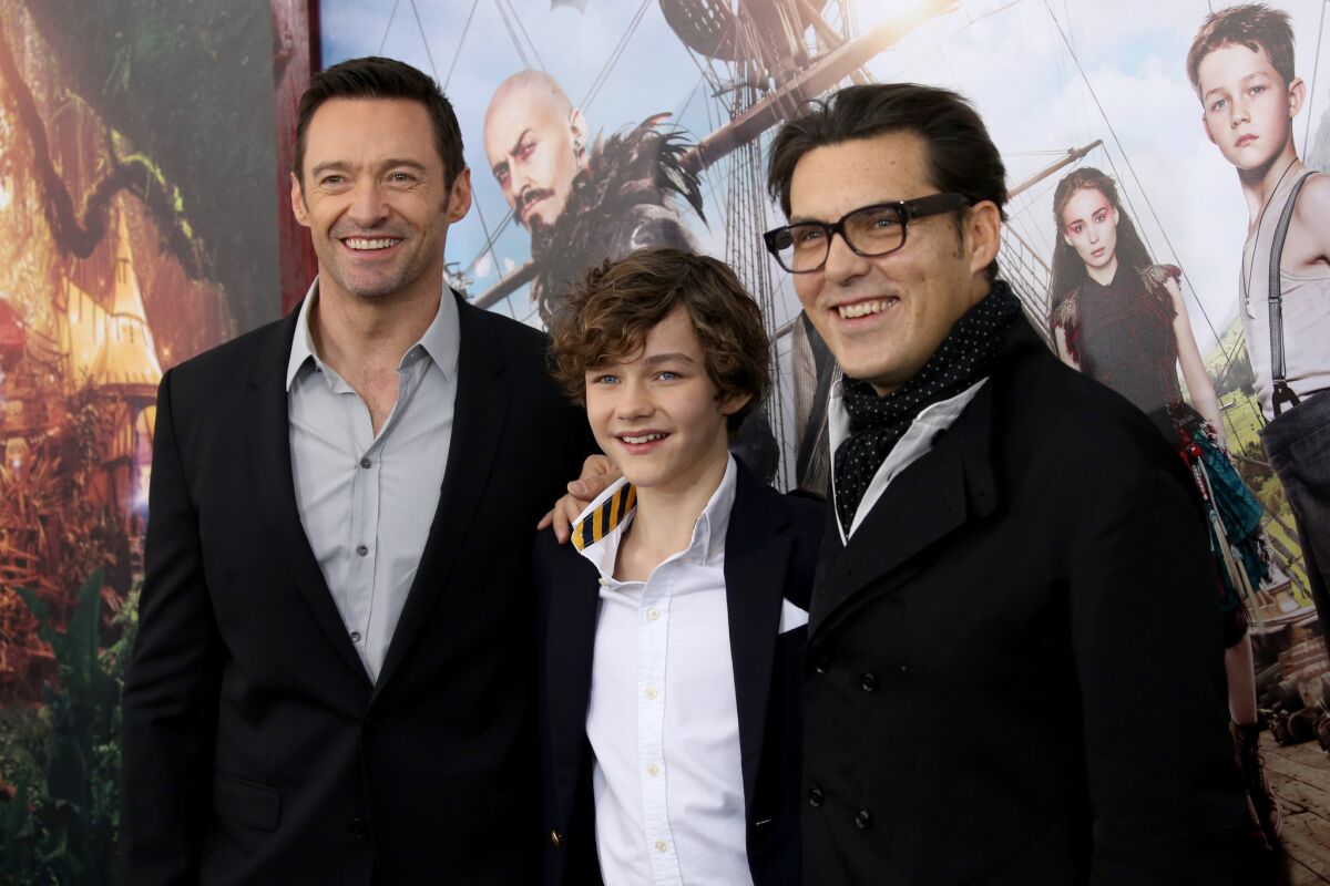 From left, Hugh Jackman, Levi Miller and Joe Wright attend "Pan" premiere at Ziegfeld Theater on Oct. 4, 2015 in New York City.