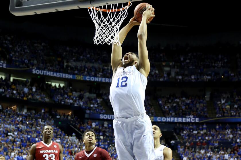 Kentucky forward Karl-Anthony Towns goes up for a dunk during the SEC tournament. The Wildcats are favored by 32 points in their NCAA tournament opener against Hampton.