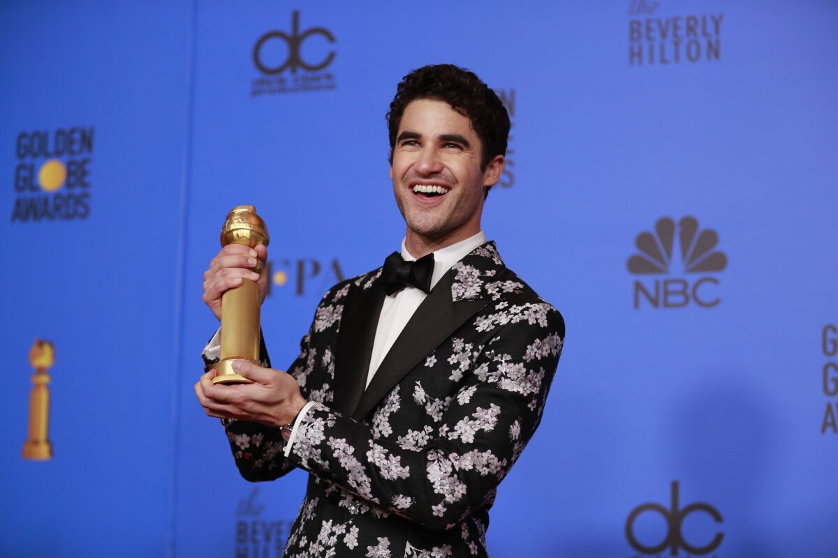 Darren Criss holds his 2019 Golden Globe for winning actor in a limited series or TV movie.
