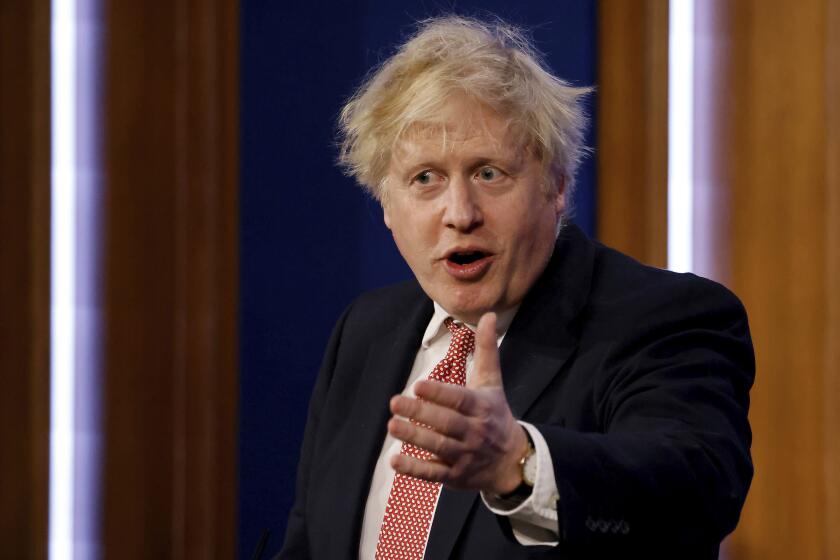 Britain's Prime Minister Boris Johnson speaks during a media briefing in Downing Street, London, Monday Feb. 21, 2022, to outline the Government's new long-term COVID-19 plan. (Tolga Akmen/Pool via AP)