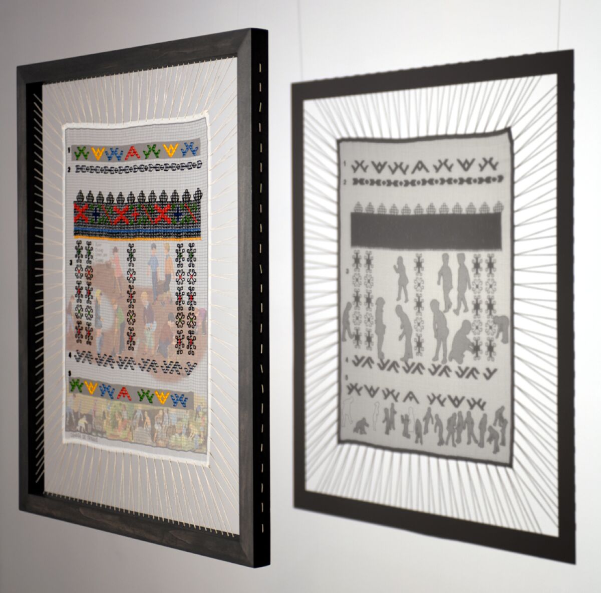 Moldovan embroidery work in an open frame and the pattern's shadow on a wall.