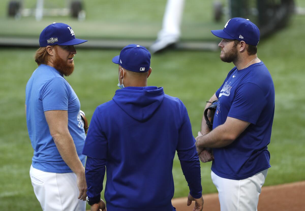 The Dodgers, shown during an NLDS workout Monday at Globe Life Field in Arlington, Texas, face the Padres on Tuesday.